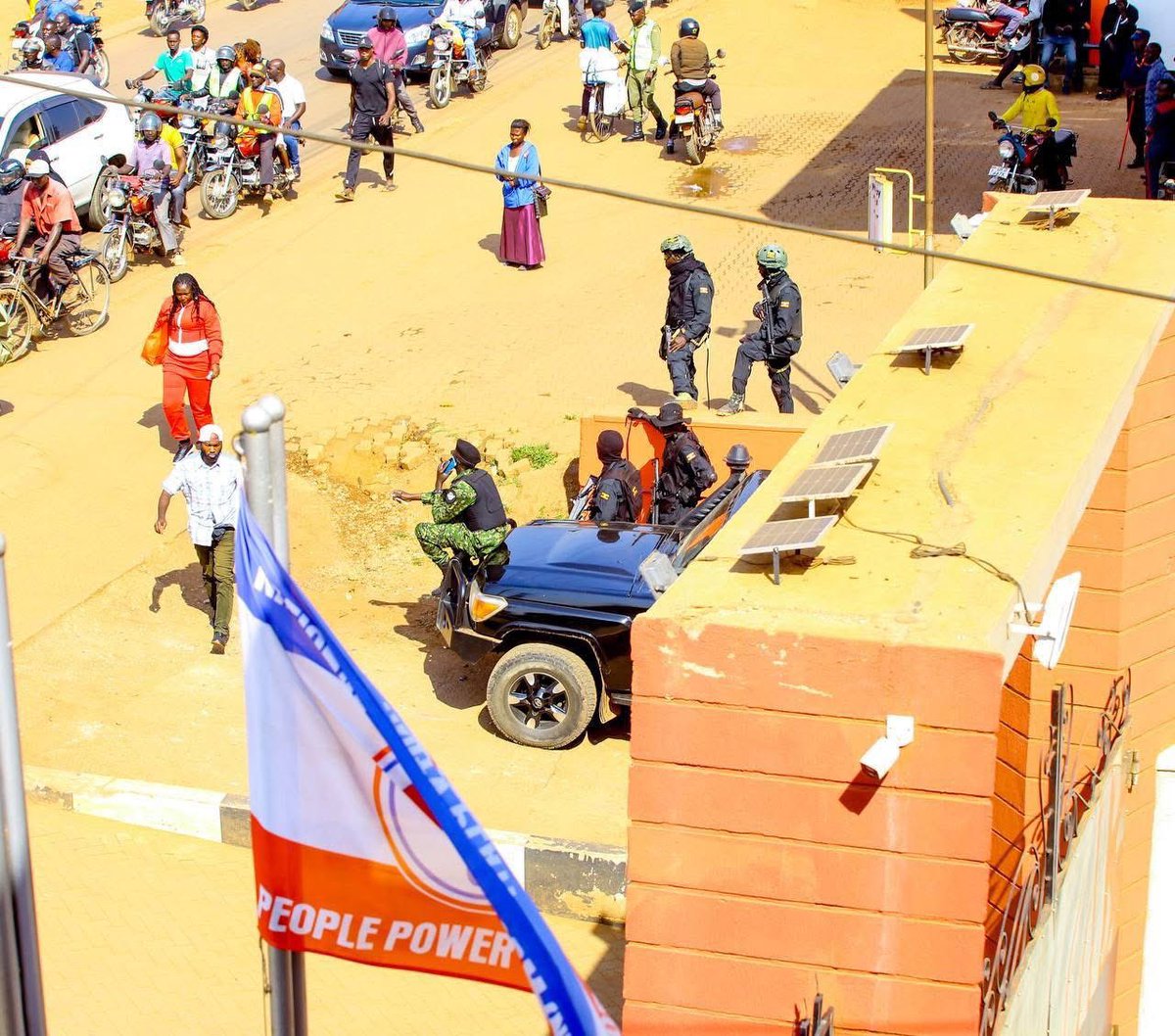 Meanwhile, this is the situation at the National Unity Platform Headquarters ahead of our prayers and joint press conference. Heavily armed operatives from the Joint Anti-Terrorism Taskforce (JATT) have raided with drones! WE ARE NOT INTIMIDATED.