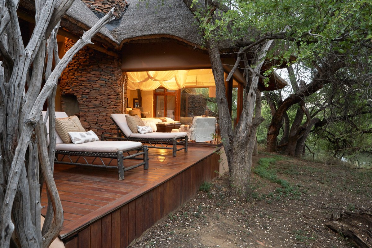 SunsetSafarisSA's tweet photo. Madikwe:Shaded by riverside forest,thatched&amp;fully air-conditioned suites at Makanyane safari lodge are secluded&amp;private,each with overhead fans&amp;fireplaces.The wrap-around glass-walled bedroom allows uninterrupted views of the Marico https://t.co/xJyrMJSxxG:Makanyane safari lodge https://t.co/3P5FZzPbZk