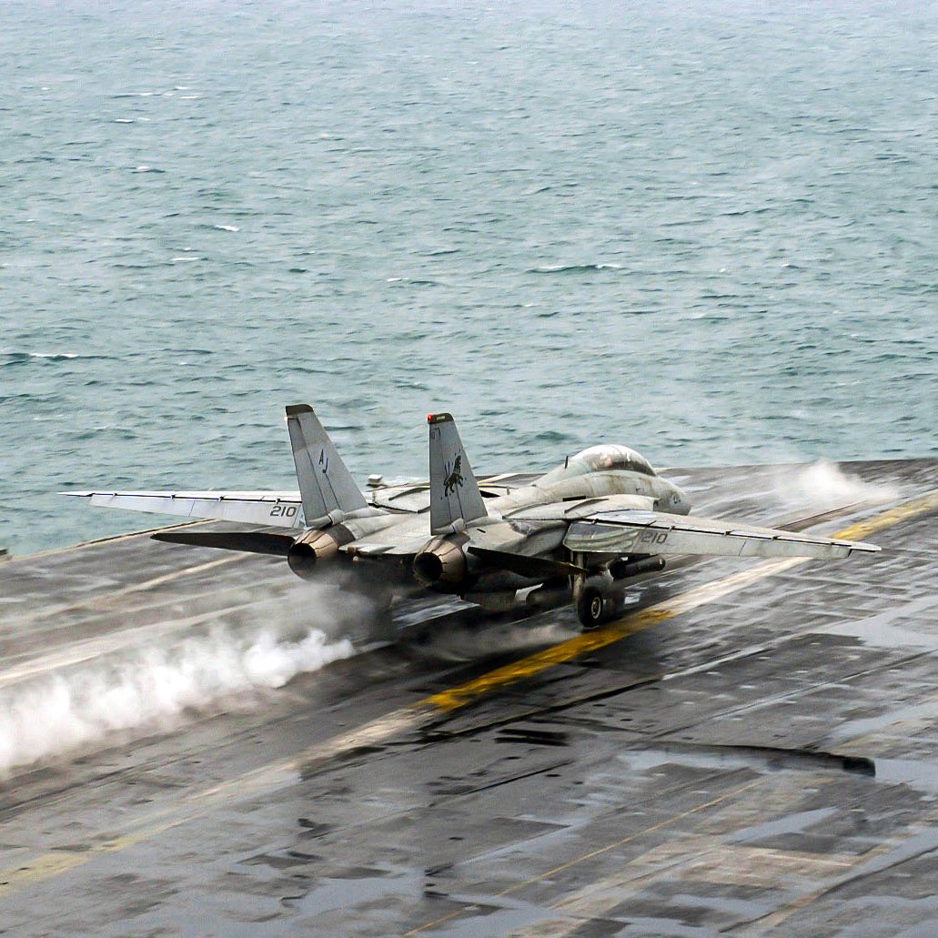 A Fighter Squadron two thirty one F-14D Tomcat launches from the USS Theodore Roosevelt in Feb. 2006. (Derek Allen)