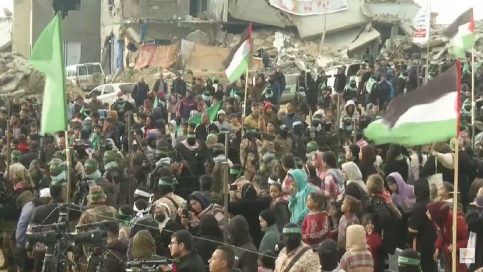 EYakoby's tweet photo. Look at all of these “uninvolved” Gazans who turned up to jeer at the corpses of four Israel hostages.

Such a sick society. https://t.co/euQhZMUQz3