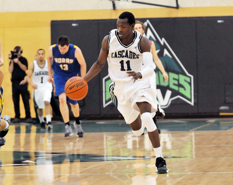 As our men’s basketball team preps for Canada West playoff action vs. Lethbridge on Friday, let's look back at Cascades hoops over the decades! 🏀
 
📷 1: Kyle Grewal in playoff action in 2012.

📷 2: Kevon Parchment playing against Lethbridge in 2013.

#UFV50 #ThrowbackThursdays