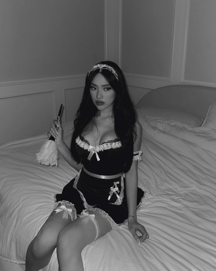 Sweet like sin, dangerous like desire—dressed to clean, but only making a mess.