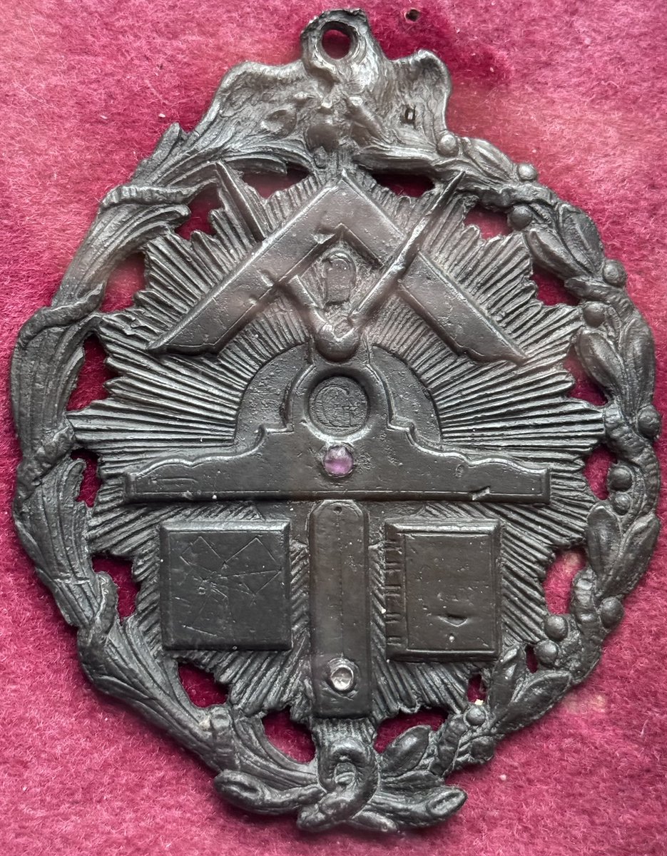 whitegoldsword's tweet photo. In the #Soane collection of #Napoleonic coins at his house at Lincoln’s Inn Fields is a lone #Masonic plaque. The symbolism is as followed-
A pair of compasses and set-square are overlaid in the tradition Masonic arrangement. Beneath is a level which contains the letter G. In #Freemasonry this depicts #Geometry or #God, the ‘Grand Geometrician of the Universe’. In Masonic lodges of the past the letter G was either positioned at the centre of the lodge in either a #BlazingStar or suspended from the lodge ceiling. In the centre is a plumb line with two squares either side. The one of the right could be the Book of Sacred Law on which the Mason swears his oath- this is the #Bible if he is Christian, the #Torah if Jewish, the #Quran if Muslim etc.
The symbol of the left is that of a past Master- Euclid’s 47th Proposition. This symbol appeared on the frontispiece of James Anderson’s ‘Constitutions of the Free-Masons’ of 1723
Behind the symbols is a blaze, all set within a floral surround.
@SoaneMuseum