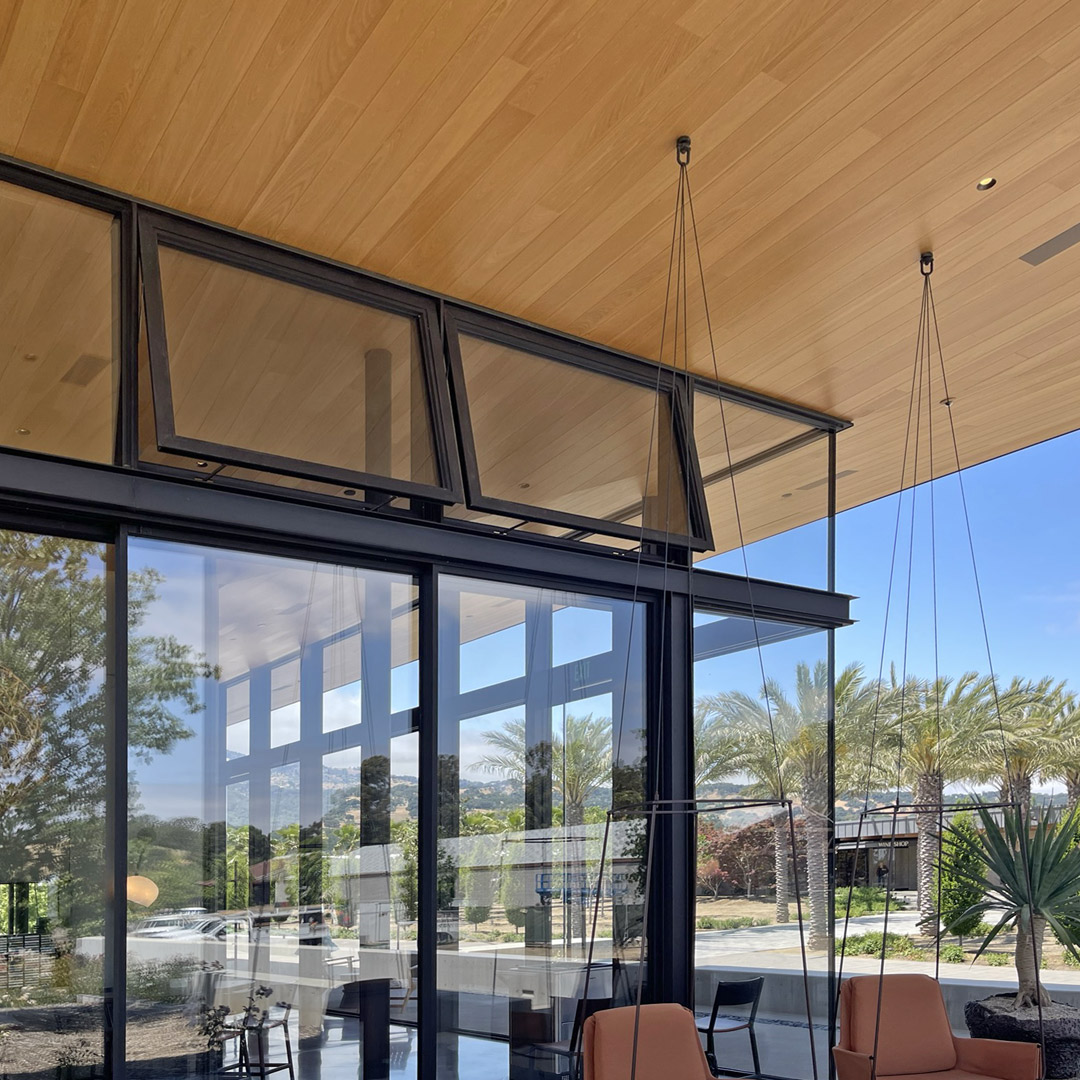 FenestrationInc's tweet photo. The Caymus-Suisun Winery project includes floor-to-ceiling glass, 30-foot-wide sliding doors on each side of the building, and an oversized skylight over the central space. The west tasting room features a 30-foot cantilevering roof, along with automated motorized awning windows. https://t.co/14fWM6cCbY