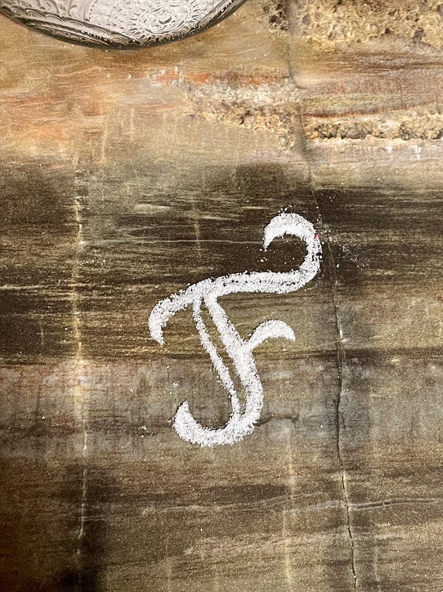 ladddesign's tweet image. Spilled some sugar and got curious to start playing with letter shapes.