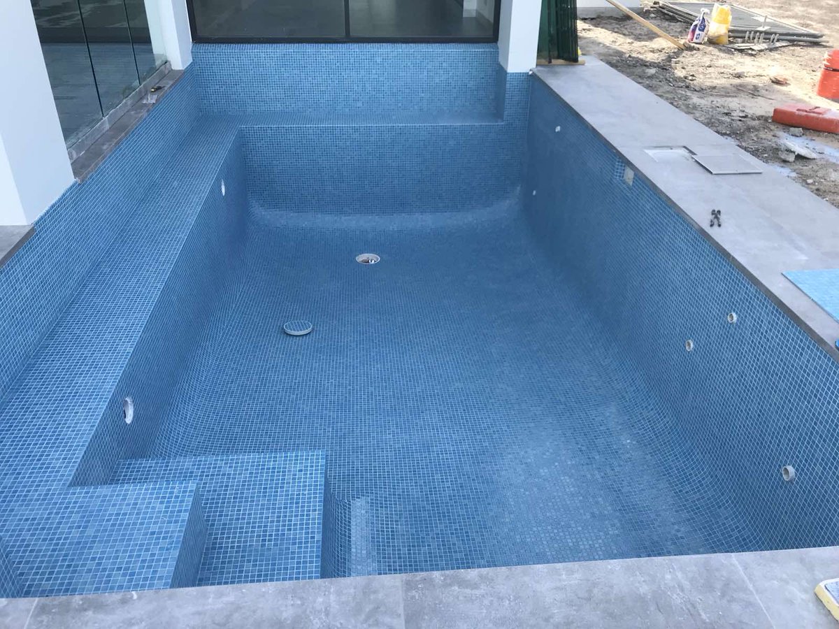 One tile at a time, we’re creating backyard oases. Interested in a pool refresh? Contact us for a consultation!