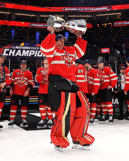 Jordan Binnington lifts the 4 Nations Face-Off Trophy in a Canada uniform. 