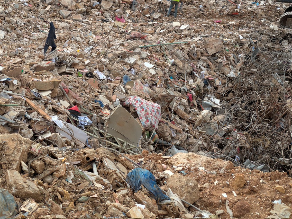 TaraAOGrady's tweet photo. One of the men I interviewed arrived to the scene ten minutes after the explosion and said that the ground had been like molten lava. 
The man in the photo with me was staring out over the detritus and told me "This was my home, everything is gone", https://t.co/dc1gSM473K