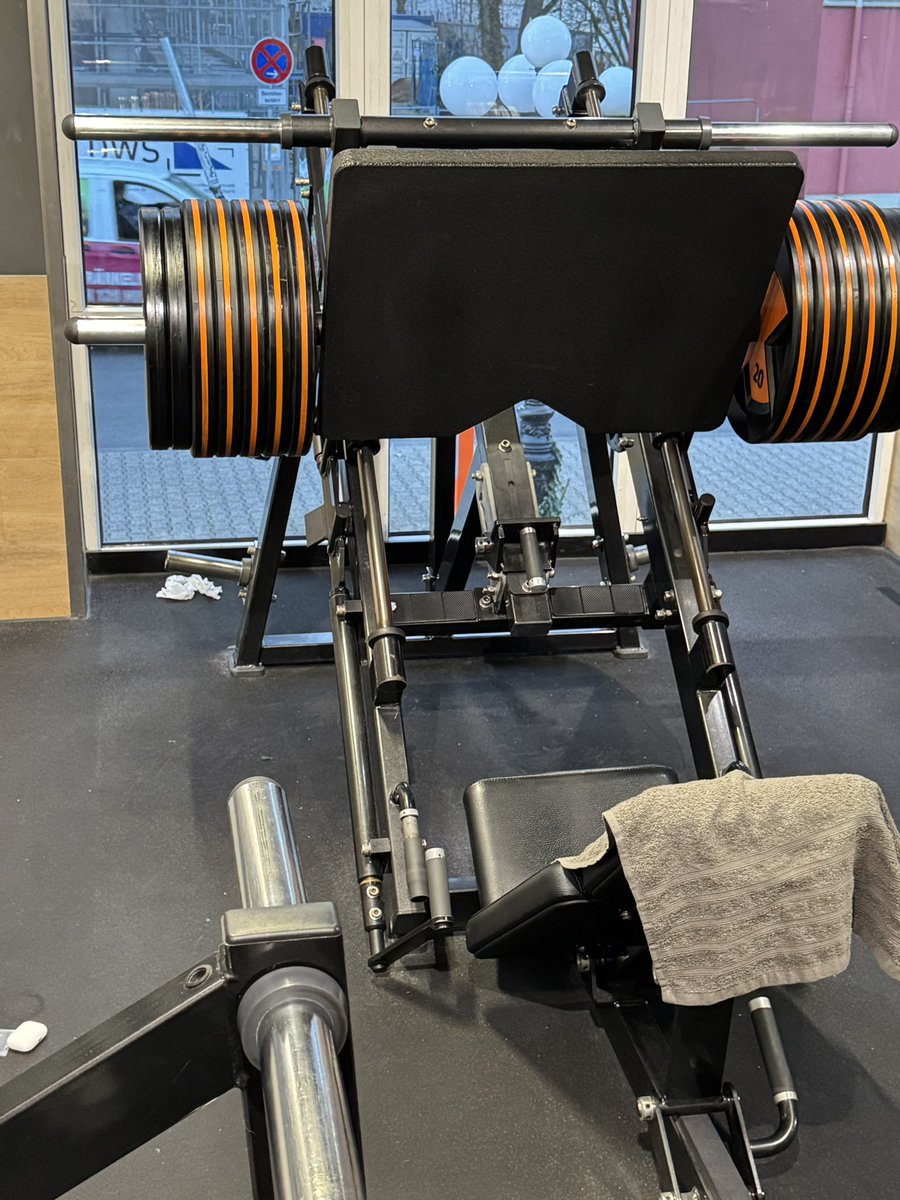 260kg 10 reps(after 1 year), if I do not press 300kg at the end of the year I will start playing league of legends again.