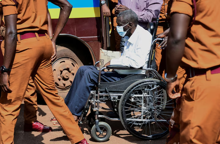 C_NyaKundiH's tweet photo. Ugandan opposition leader Kizza Besigye, who arrived in court in a wheelchair, formally charged with treason, with prosecutors alleging he held meetings in Switzerland, Greece, and Kenya between 2023 and November 2024 to solicit military and financial support for overthrowing President Yoweri Museveni’s government.