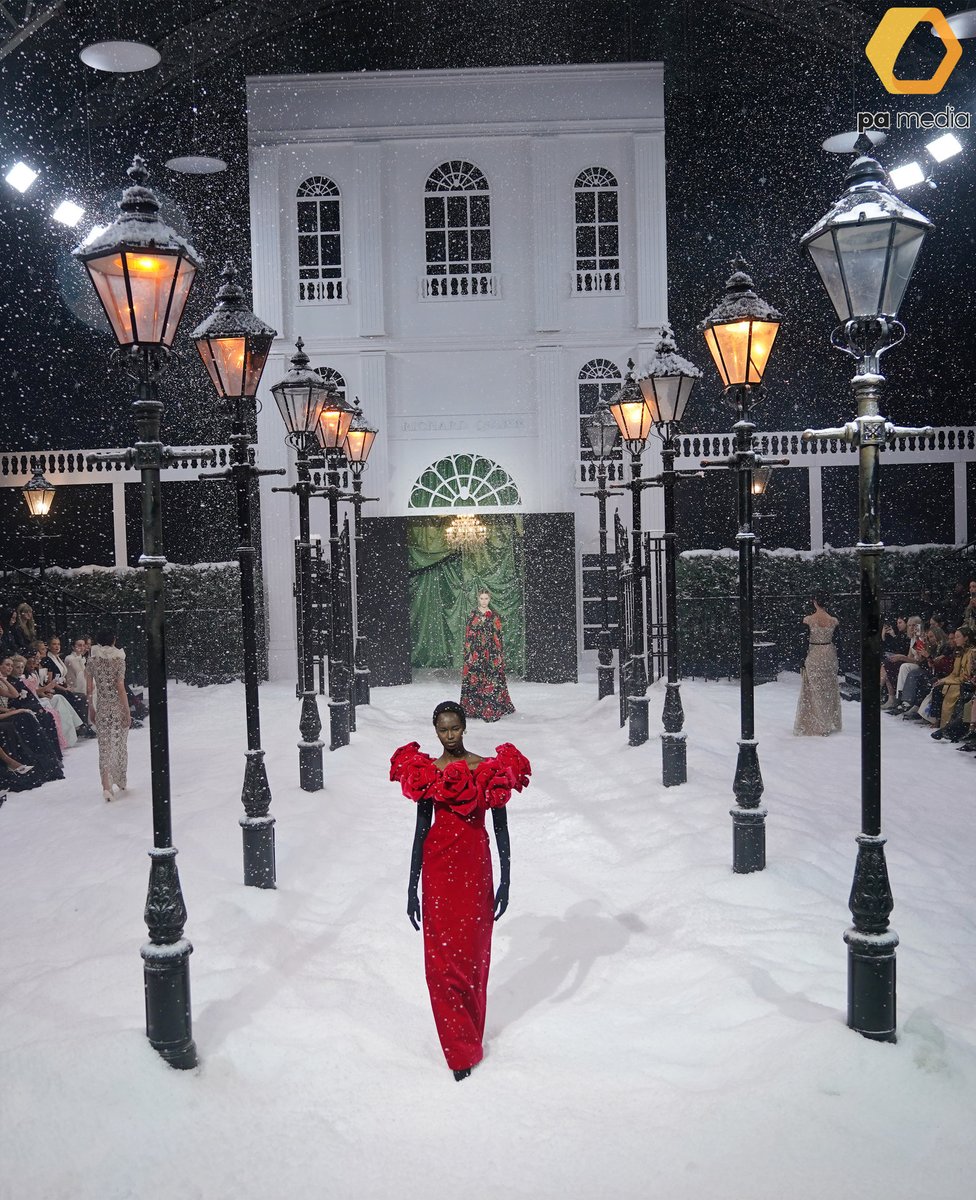 Models on a catwalk blanketed by artificial snow, during the Richard Quinn Fall 2025 show in The Lindley Hall at the Royal Horticultural Halls, London, during London Fashion Week. #LFW