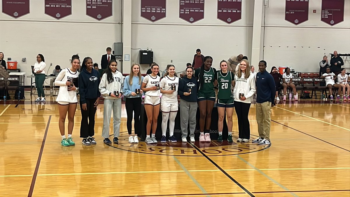 STAB with the championship trophy. Zoe Burruss and Keegan Morris also honored first-team All-LIS, while Harmony Williams earns LIS Player of the Year honors.