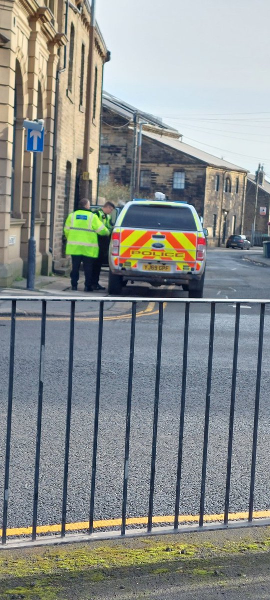 CarrieOrwin's tweet photo. @WestYorksPolice Want to explain why you have 2 men manhandling and fully searching a woman in the middle of Milnsbridge, before bundling her into your vehicle? https://t.co/zfl0DdxJ3q