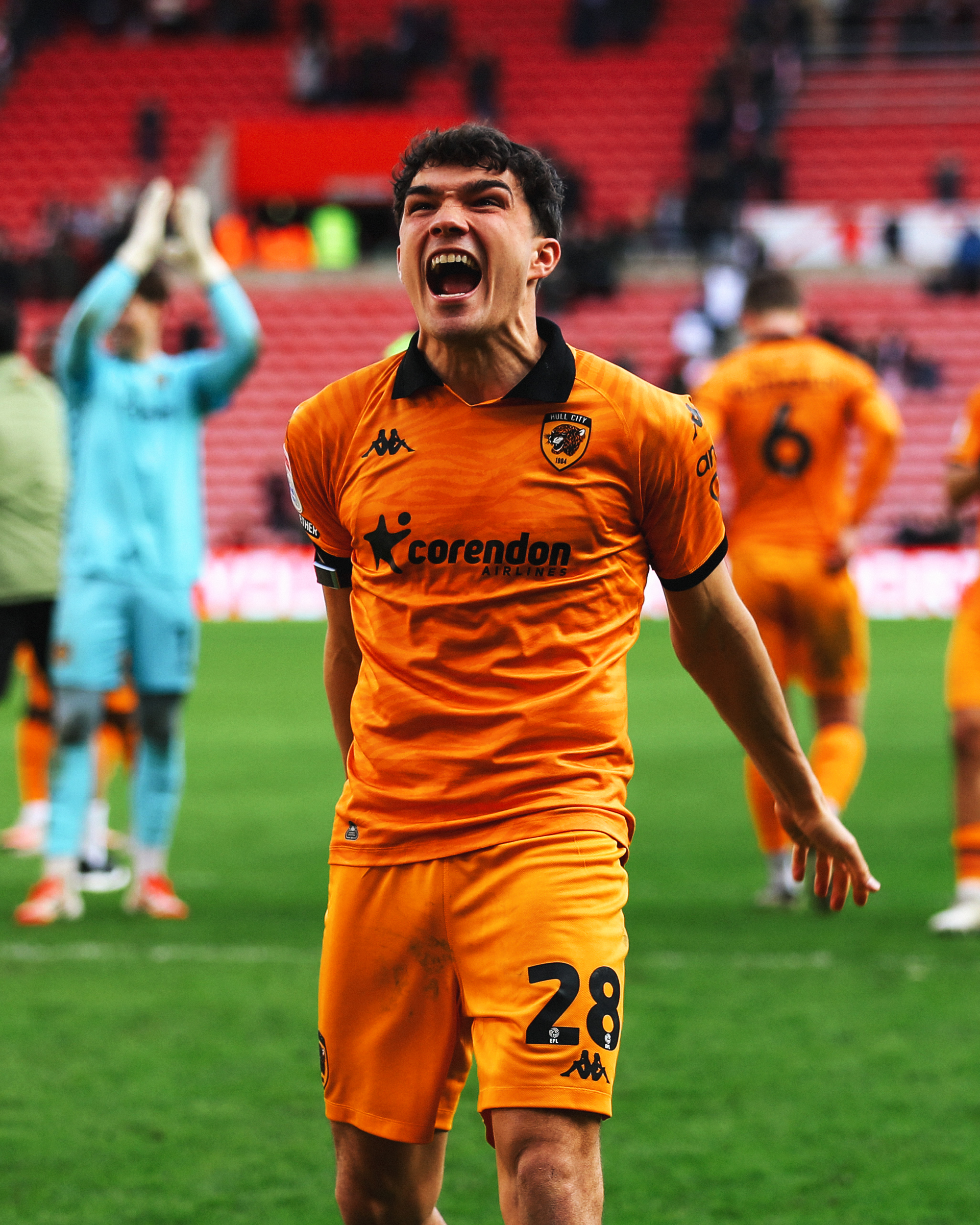 Kyle Joseph celebrates with the fans at full time.