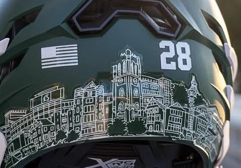 Michigan State’s lacrosse helmets are some of the best in the country. Clean design, bold look, and a beautiful skyline representing iconic buildings on campus.