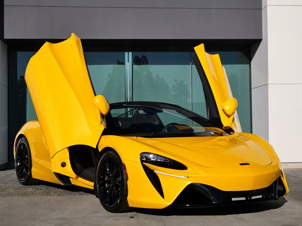 2025 McLaren Artura Spider shown in Volcano Yellow | Price: $322,508