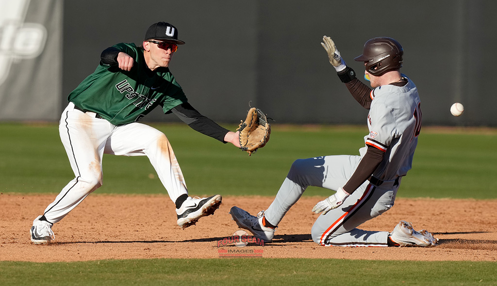 Center fielder TJ Takats (10) of the Bowling Green Falcons steals second base as second baseman Alex Ritzer (5) of the USC Upstate Spartans awaits the throw on Friday, February 21, 2025, at Cleveland S. Harley Park in Spartanburg, South Carolina. (Tom Priddy/Four Seam Images)