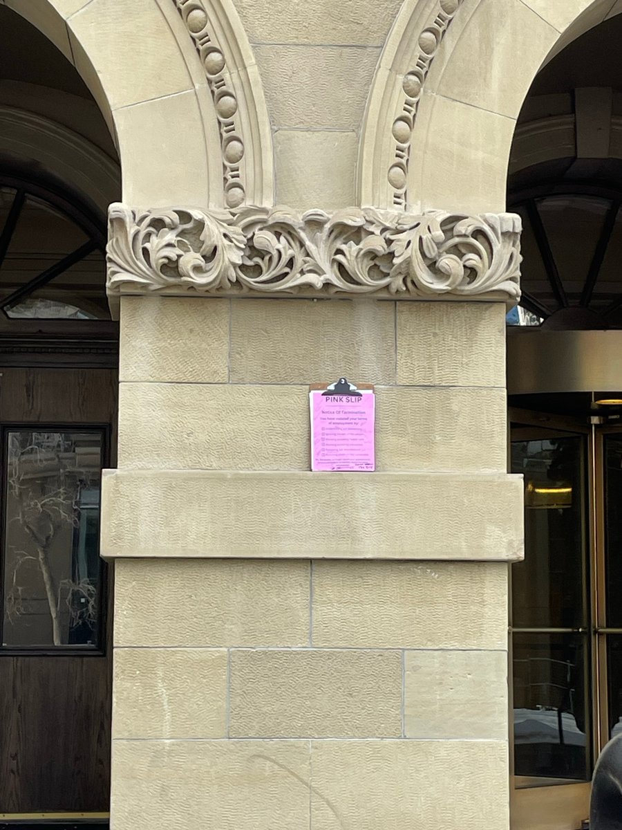 Ashantz6's tweet photo. Today many people came to the Calgary McDougall Centre to give a Pink slip to @ABDanielleSmith and call for a public inquiry. Video of pink slip protestors posted by someone on Blue Skies. Currently waiting for more pictures - my sign was too big to hold & manage a camera. #AbLeg https://t.co/BJc6DeRNMV