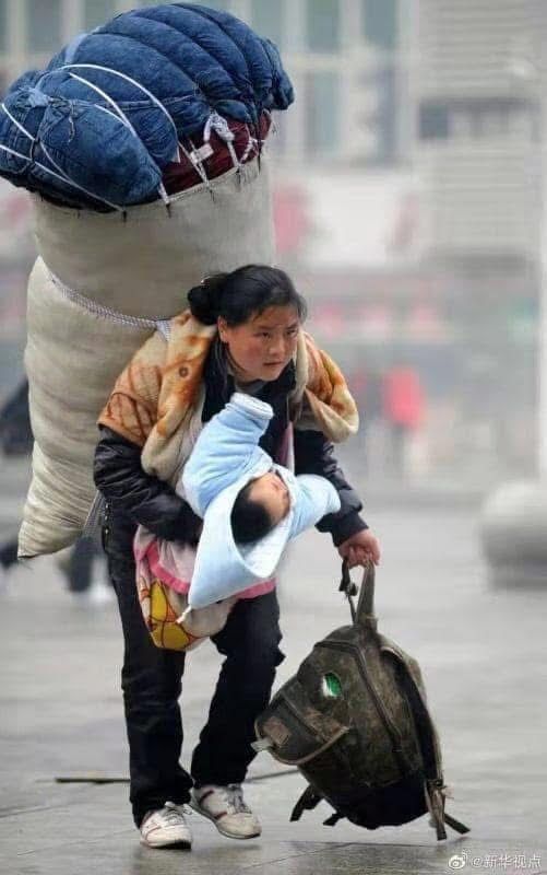 This photo was awarded the China News Photography Gold Medal:

"On my shoulders is responsibility, I hold hope in my arms"