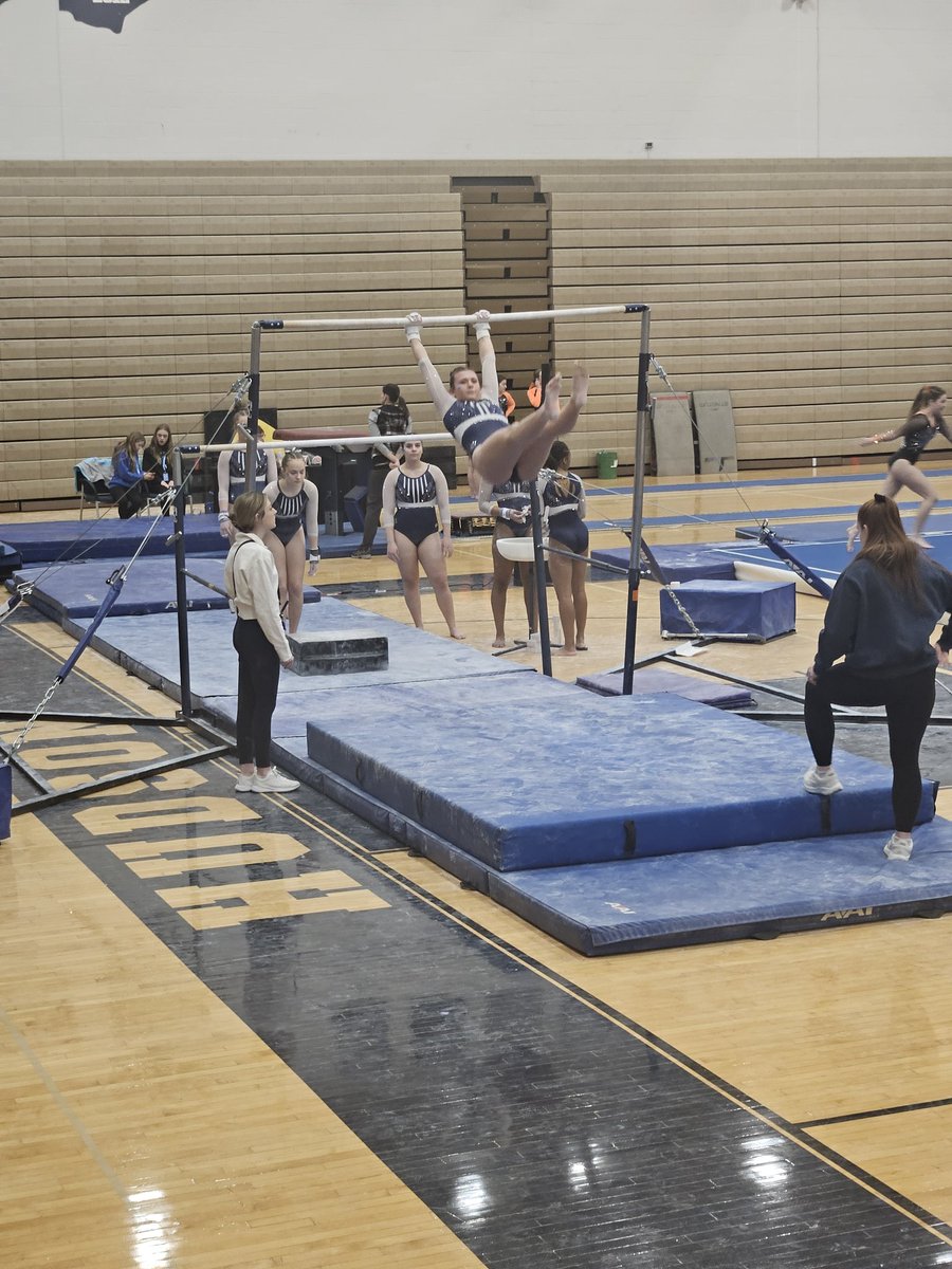 Lady Tigers warming up on uneven bars to start the day!