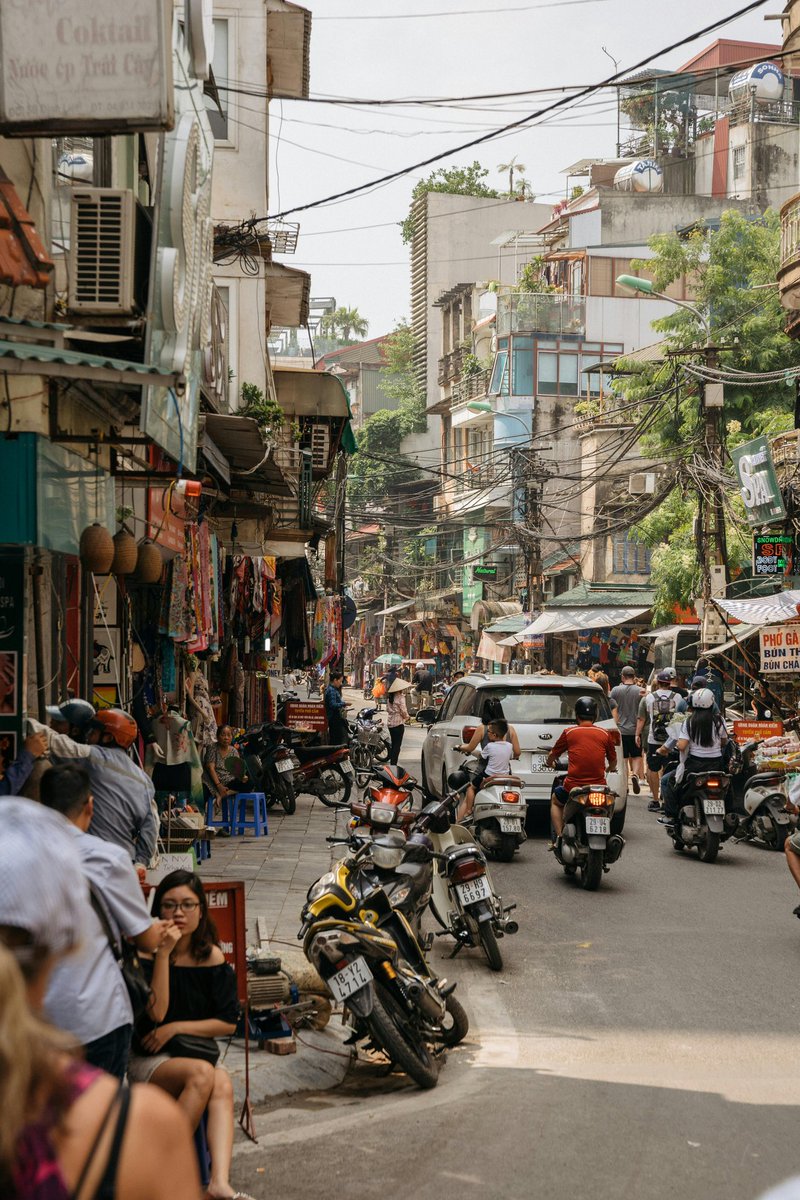 TripCheersMe's tweet image. In the heart of Đống Đa, Hà Nội, life unfolds on the sidewalks—locals sipping coffee, sharing stories, and soaking in the city’s rhythm. A simple scene, yet full of warmth and culture. 🇻🇳✨ #TripCheersVietnam #StreetLife #HanoiVibes”