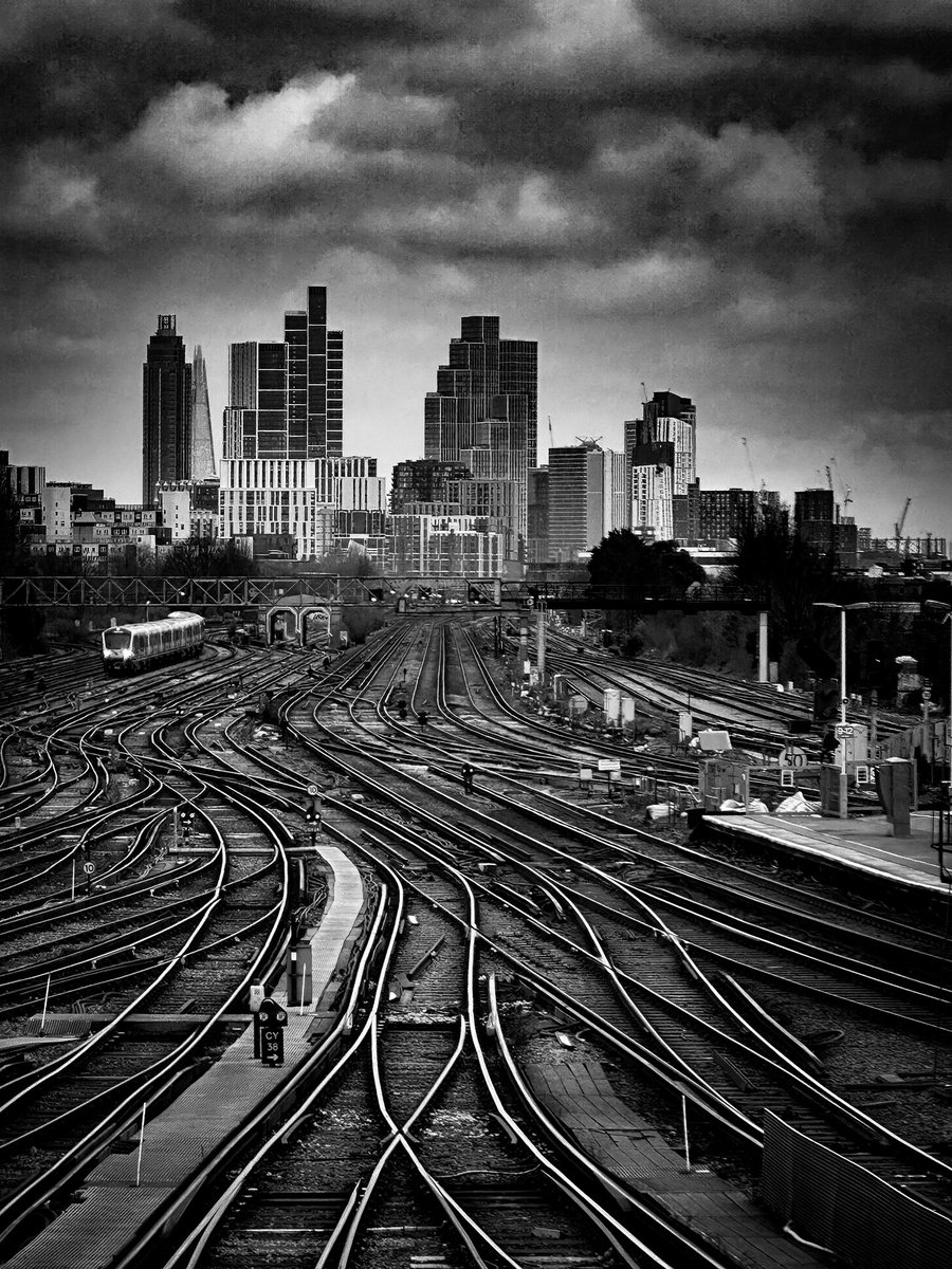 And now I’m here, staring out of a window at Clapham Junction railway station. A very fine view, missed by most as they hurry past.