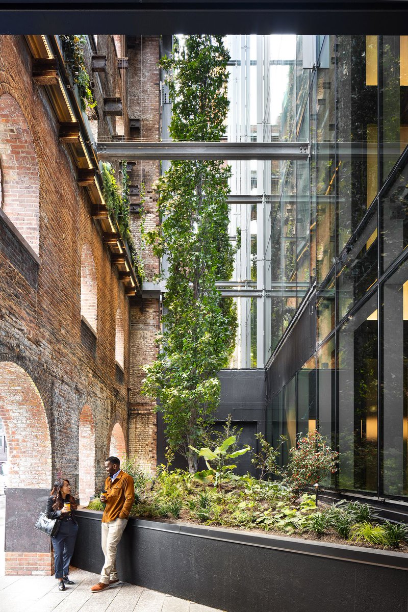 Exposed steel beams, backlit glass and rugged New York Schist define the industrial-inspired Domino Refinery lobby.

Details: arc.ht/41qWkNL |📍Brooklyn, Kings County, NY, US #ArchitizerAwards