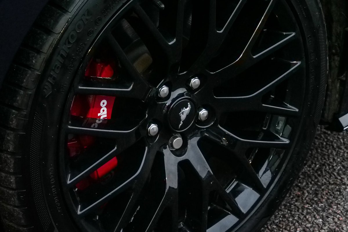 Check out this Ford Mustang GT we just completed the following on:

- Smoothed off all exterior textured trims and  painted in gloss black with a white pin line.
- Colour changed the callipers to a gloss red and lacquered in <a href="/brembo/">brembo</a> decals.
- Smoked rear bumper reflectors