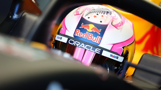 A close-up of Liam Lawson in the RB19 with his helmet on.