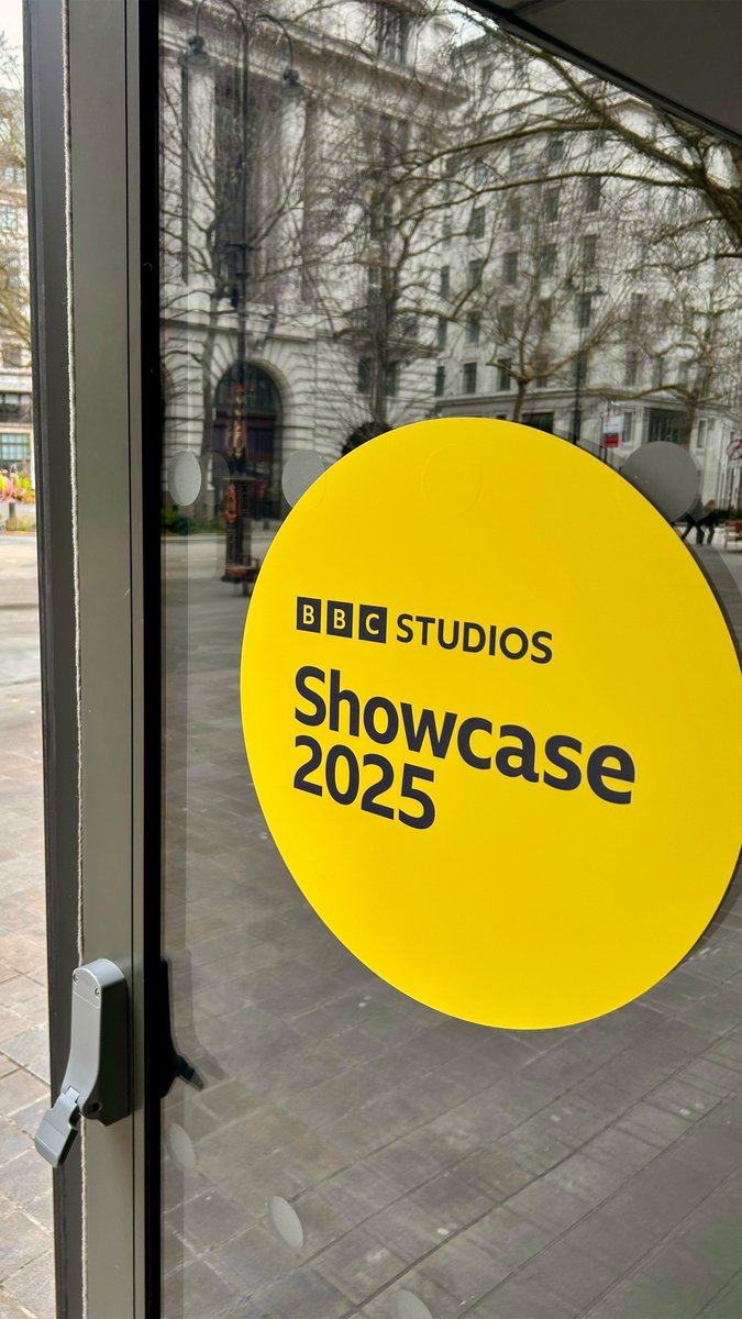 BBC Studios Showcase 2025 logo in a yellow circle can be seen on an open door.