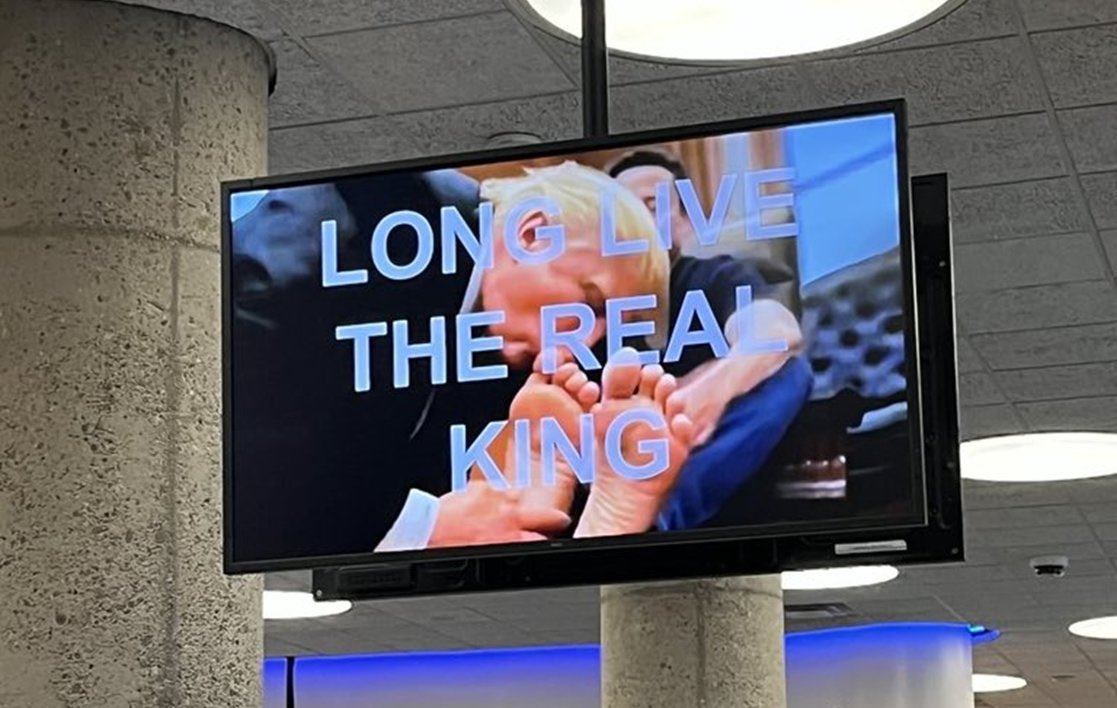 CalltoActivism's tweet image. Holy shit. The screens have reportedly been hacked at the Department of Urban and Planning and now depict an image of Donald Trump kissing Elon Musk’s feet.
