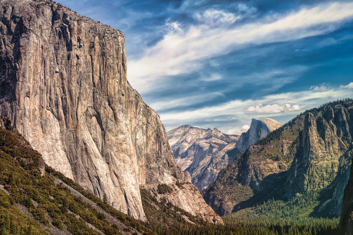 This is the stunning scene that first greets the visitor to Yosemite Valley in Yosemite National Park, California. El Capitan is on the right and Sentinel Rock on the left. Behind Sentinel rock is the world famous Half Dome. #yosemite #travel #photography