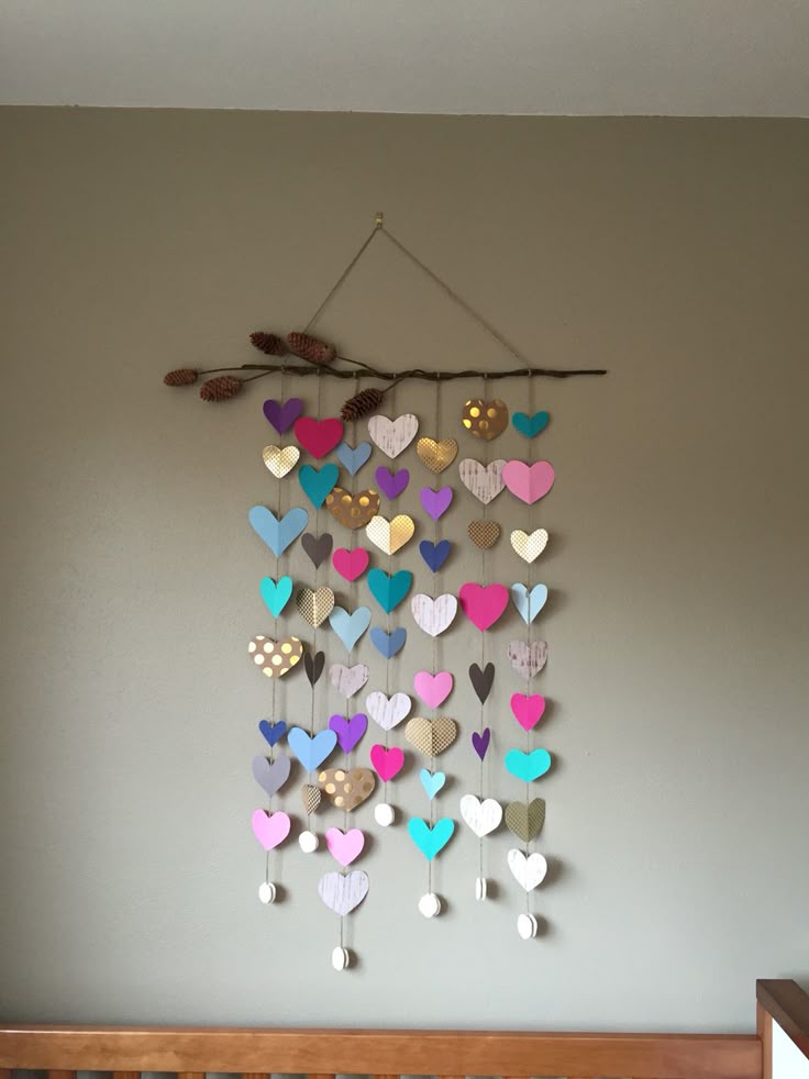 Add a cozy touch to your home with DIY Yarn Wall Hangings!Use yarn, a wooden dowel, and some creativity to make beautiful wall decor. #dreamyDIYs #YarnCrafts