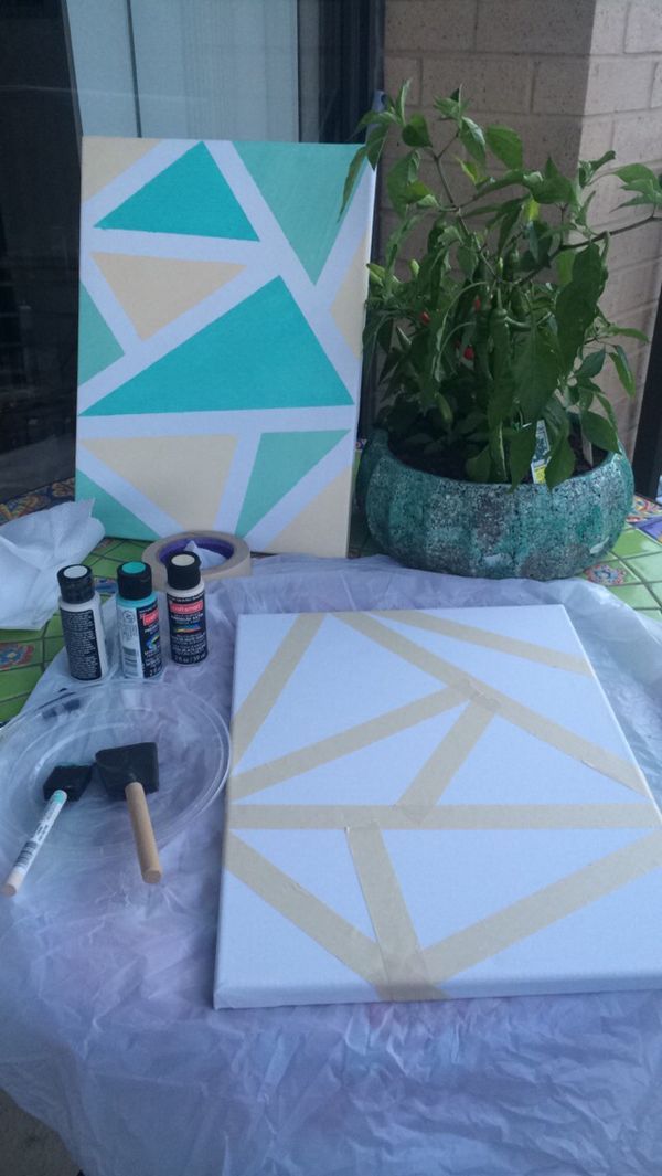 Add a modern touch to your home with DIY Geometric Wall Art! Use painter's tape, canvas, and acrylic paint to create stunning geometric designs. 
#dreamyDIYs #GeometricArt