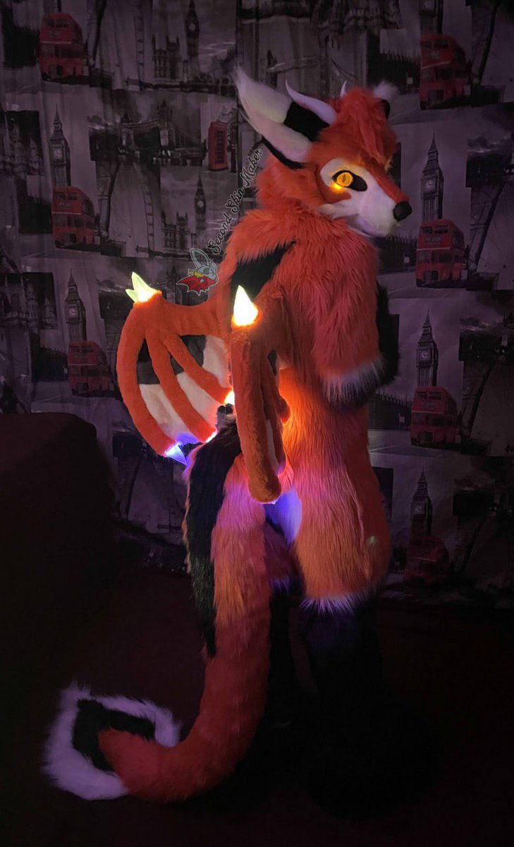 This was an incredibly exciting project! Wings with custom lighting in multiple colors, 3D-printed resin crystals and teeth, plus silicone paw pads and tongue. This is the first highly complex fursuit I've ever made. I think the final result turned out great!