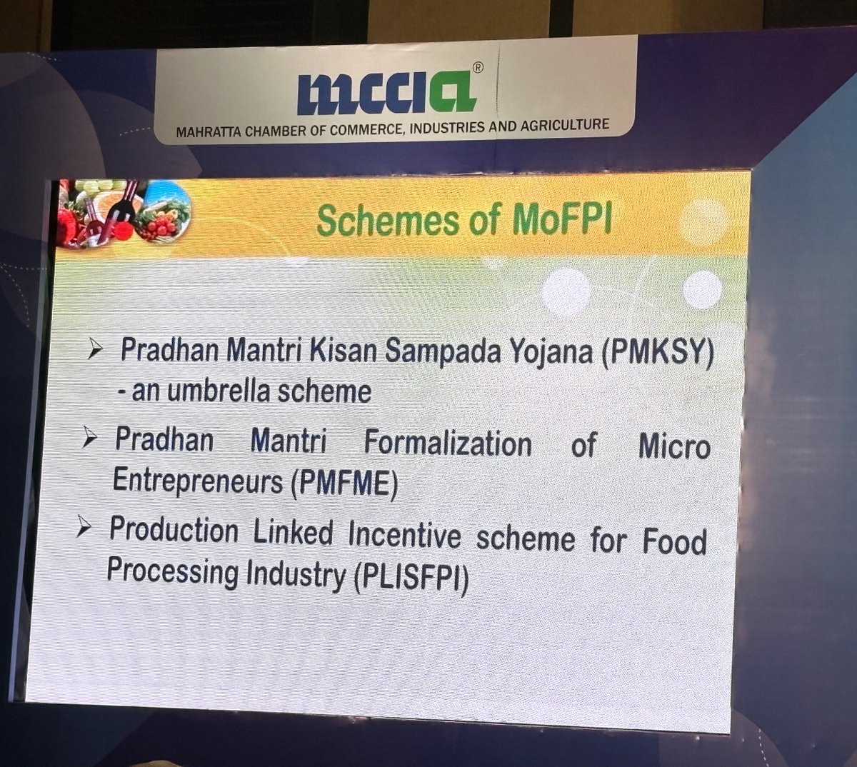 MCCIA_Pune's tweet photo. Dr. Jitendra Dongare, Deputy Agricultural Marketing Adviser (SAG), @MOFPI_GOI, speaking at the #PuneInternationalBusinessSummit 2025, by @MCCIA_Pune.

He emphasized Pune’s role as a technology-driven city that embraces Industry 4.0, automation, and R&D. He highlighted how government initiatives, such as food parks and incentives, have made Pune a preferred destination for food processing investments.

The sector’s contribution to the economy is growing, with #Pune leading efforts in sustainability, including biodegradable packaging and green manufacturing.

He also highlighted various schemes of the @MOFPI_GOI, to support the sector.
