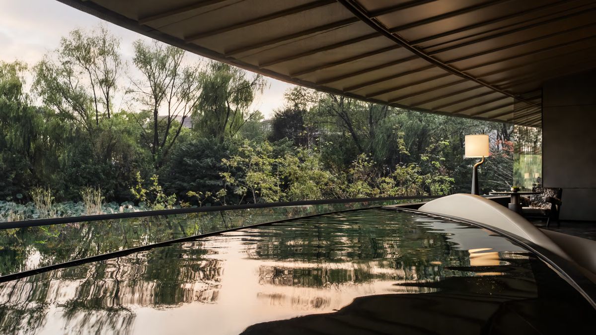 This lakeside pavilion follows the land’s natural contours, creating a flowing architectural form that mirrors the hills and water around it.

Details: arc.ht/4hdxe9X |📍China #ArchitizerAwards