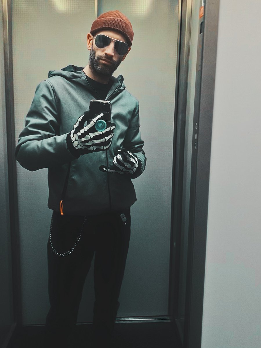 Foxtech_edc's tweet image. &quot;🚀 Spotted: The coolest elevator rider in town! 🦴 Rocking skeleton gloves, a sleek jacket, and a mysterious vibe—ready to haunt the 21st floor or just slay the day? 👻 Drop a 🔥 if you’d ride with this legend! #StyleIcon #ElevatorSelfie #ViralVibes&quot;