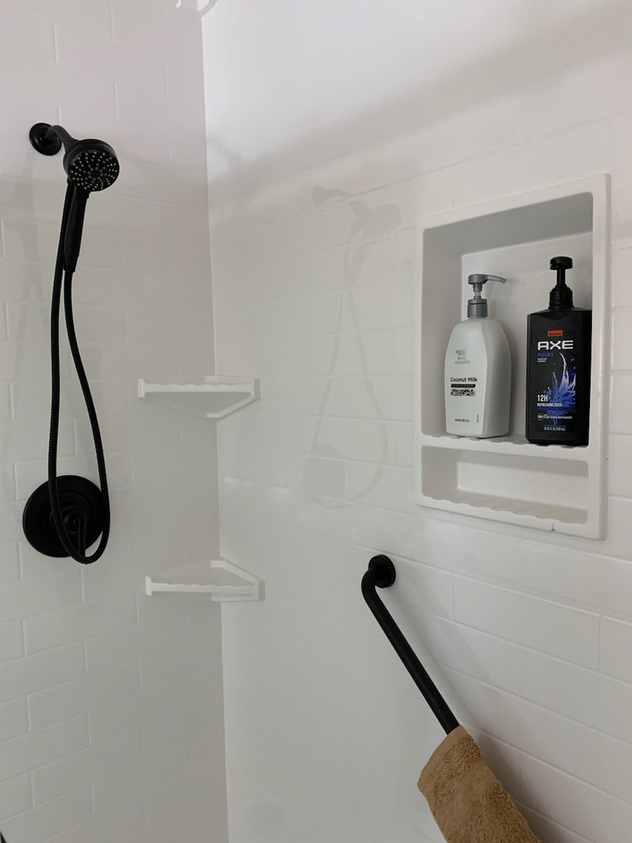 BathManRemodel's tweet photo. Checkout this new Onyx shower we just installed in Churubusco! The walls are a simulated subway tile. A recessed niche was installed for extra storage space. The matte black fixtures and door create a crisp clean appearance. https://t.co/NQ4VOdOmrS
