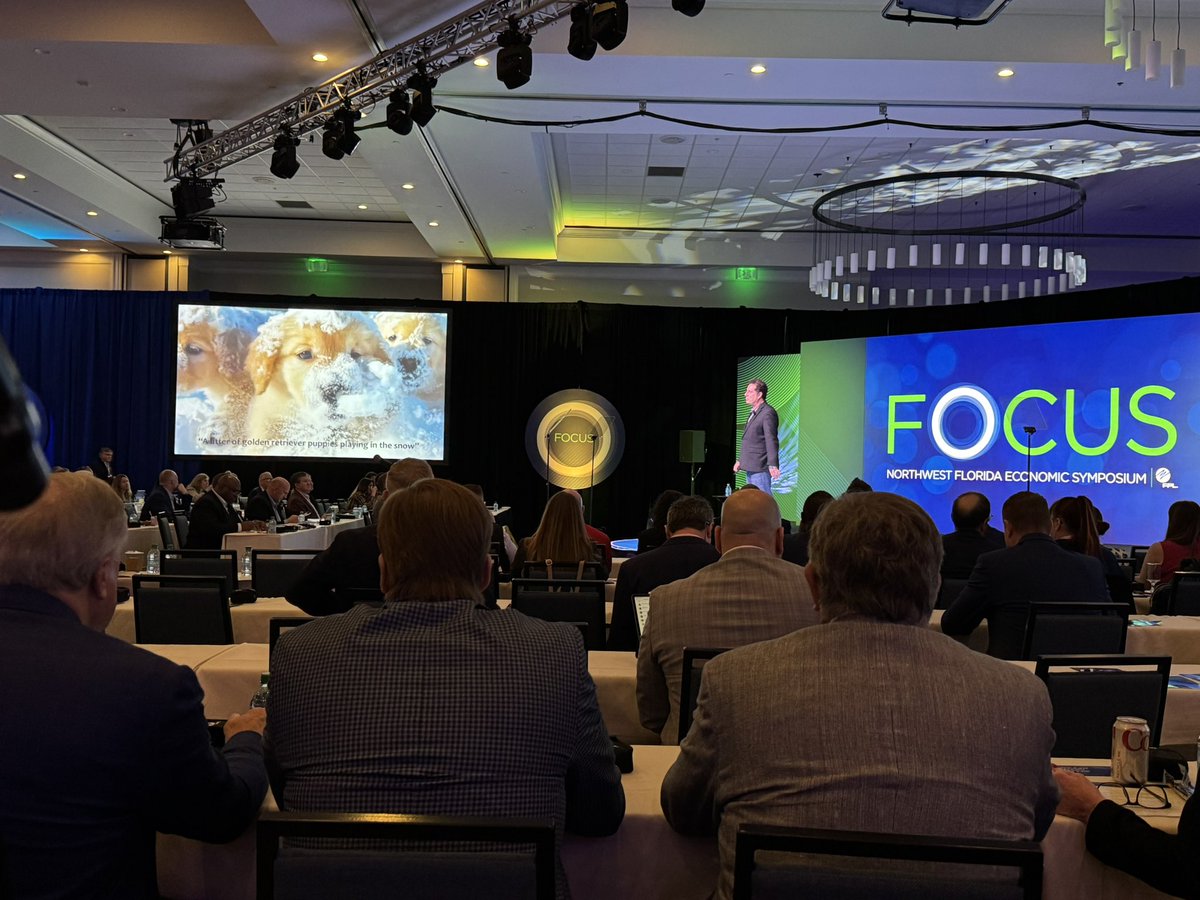 insideFPL's tweet photo. Hod Lipson, Professor of Engineering and Data Science Columbia University, discusses the advancements of AI at the Northwest Florida Economic Symposium. In this picture, he's showcasing a video of puppies playing in the snow generated by AI. #OneNWFL https://t.co/HtTPocDv8N