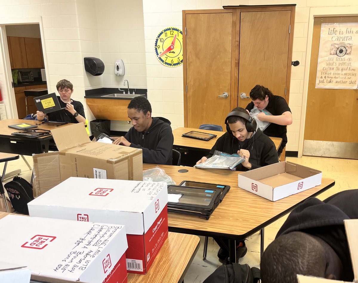 Transition Academy (Next Step) students assemble loaner computers for classrooms. Their contributions positively impact AAS. 💙