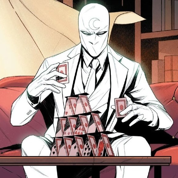 He is playing cards. Kinda.