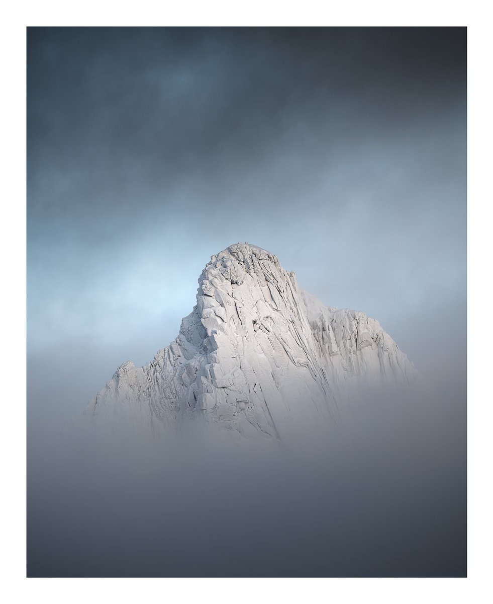 Breaking through the clouds-one of the tallest peaks in the Lofoten Islands.