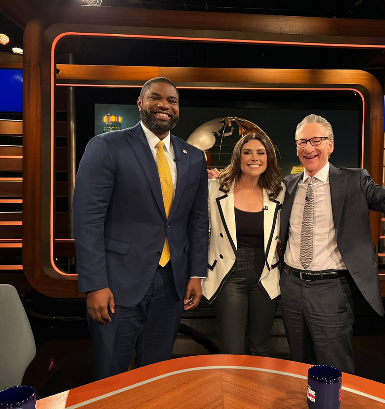 Fritschner's tweet photo. Left: Brittany Petterson votes in the House with her newborn son a month after giving birth because Republicans barred remote voting for new mothers

Right: Byron Donalds votes in the House secretly by proxy from the set of Bill Maher in Los Angeles, breaking House ethics rules https://t.co/MarU0JIhZ5