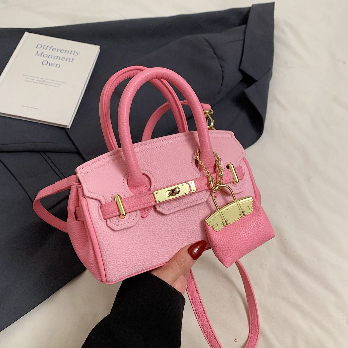 <a href="/instablog9ja/">Instablog9ja</a> Hermes Bag
In Pink and Blac
Price: N30,000(midi) N25,000(mini)