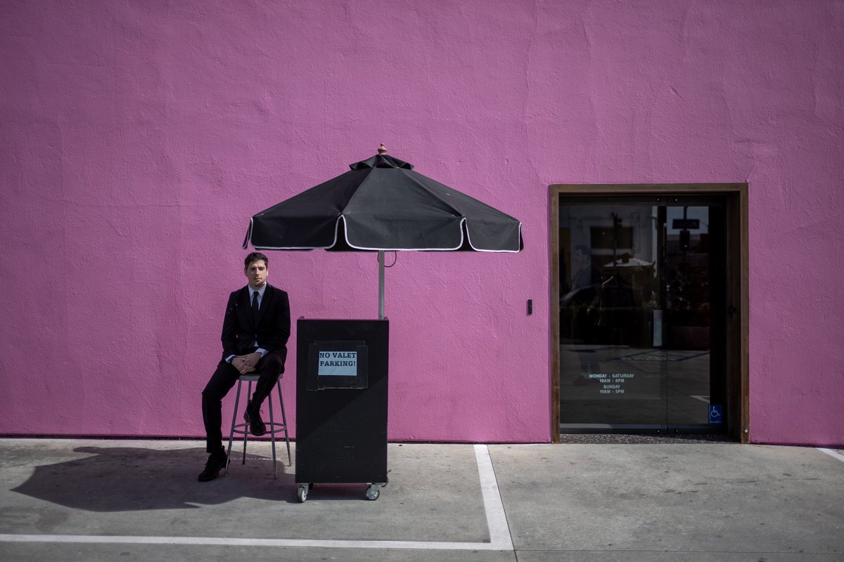 Security officer Ryan Raftery outside of the Paul Smith shop on Melrose Avenue in Los Angeles #pinkwall #melrose #paulsmithmelrose #losangeles