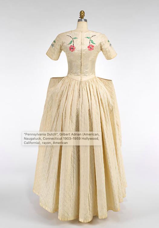 MadameGilflurt's tweet photo. When #GilbertAdrian discussed his 1947 "Pennsylvania Dutch" look with Vogue, he admitted that the #frockingfabulous number had been designed "purely for prettiness, for the big romantic moments." It's got Adam and Eve, the Tree of Life and even a little dog! Via the Met. #fashionhistory