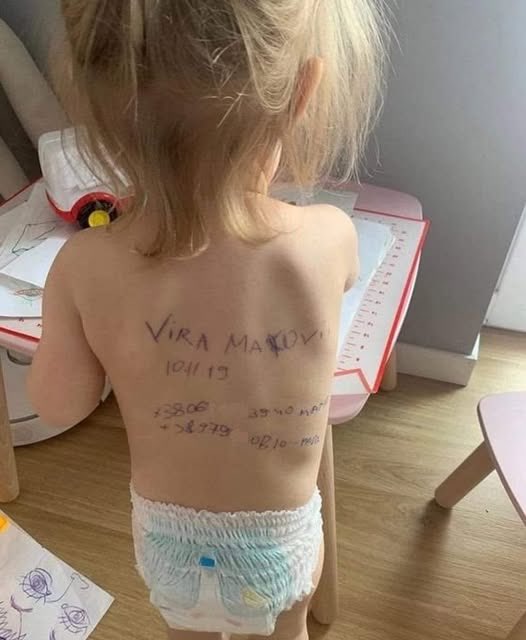 This photo should definitely appear in the <a href="/UN/">United Nations</a>. The girl survived. The parents wrote their data and the girl's data on her back in case they die. This is Mariupol!
This happened because the russians came to kill Ukrainians.