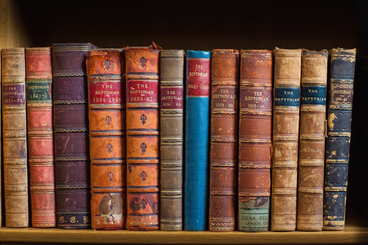 ReptonArchives's tweet image. Celebrating the first #SchoolArchivesDay with four photos of the School Archive, including documents from the medieval Priory, a 1621 charter bearing the Great Seal of James I, bound copies of the School magazine, and a photo of me perusing a volume of bound 17th century letters.