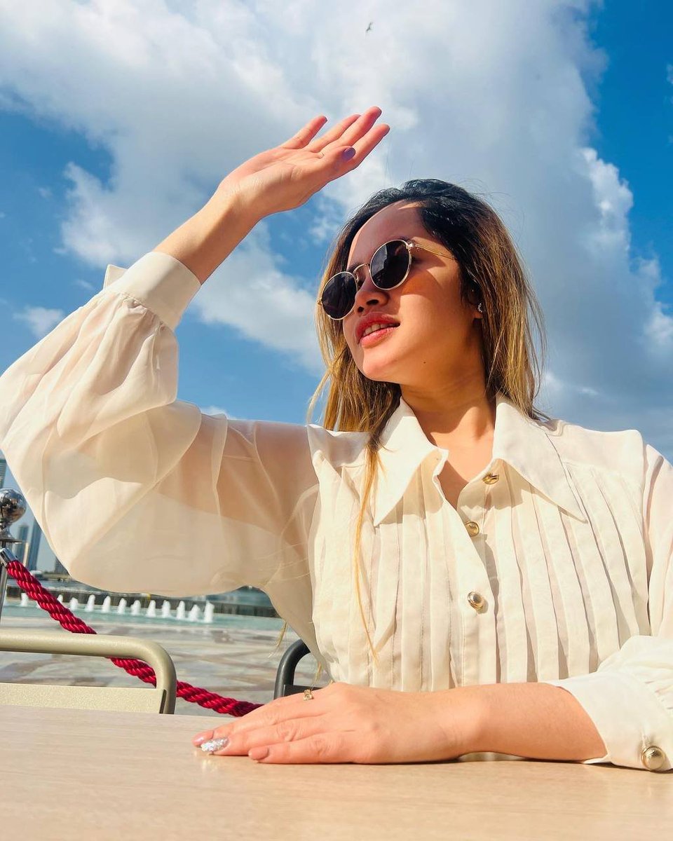 "Soaking up the sunshine in style!  #SummerVibes #FashionGoals"